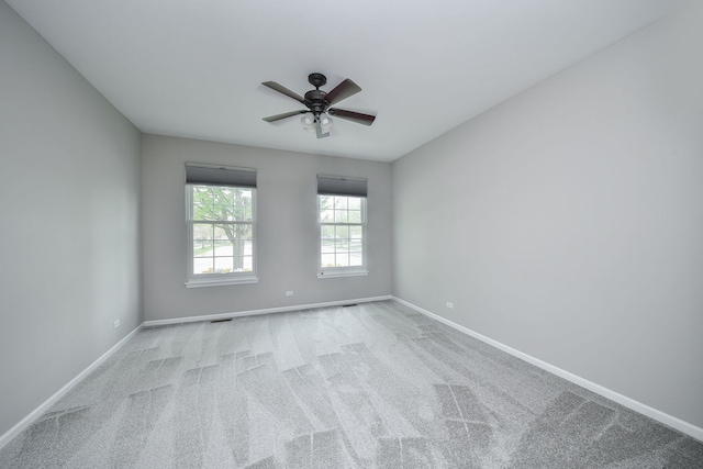 unfurnished room featuring baseboards, a ceiling fan, and carpet floors