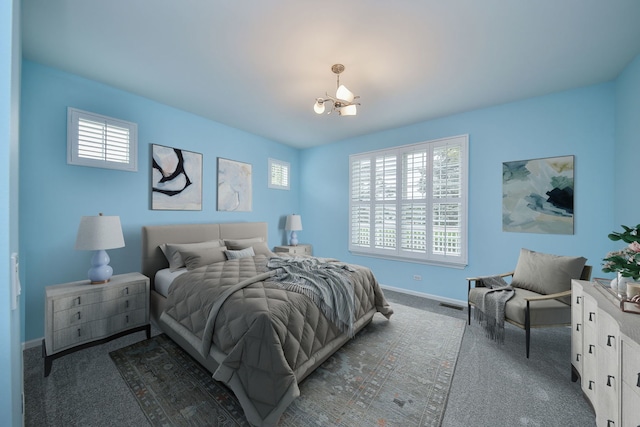 1834 Highbury Ln, Aurora, IL 60502 - carpeted bedroom with a chandelier and baseboards