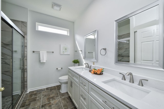 full bath featuring a sink, baseboards, a stall shower, and visible vents