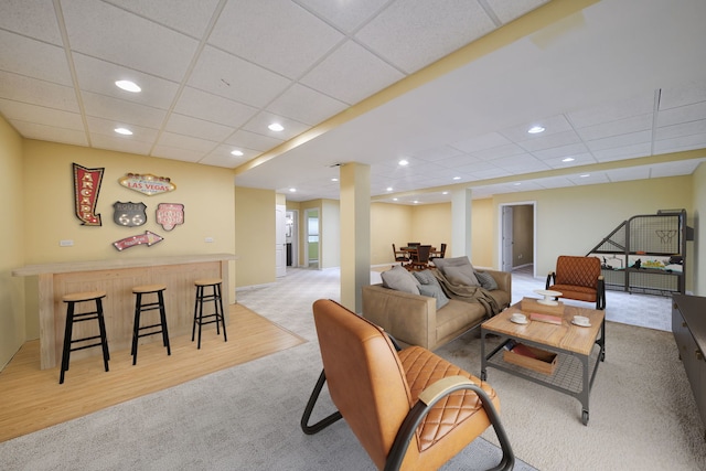 1834 Highbury Ln, Aurora, IL 60502 - living room featuring light carpet, a drop ceiling, a dry bar, light wood finished floors, and recessed lighting
