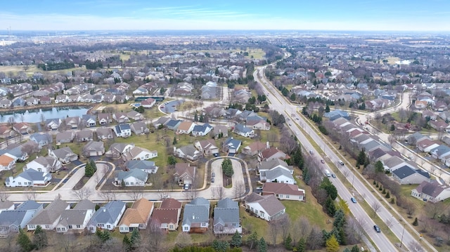 bird's eye view with a water view and a residential view