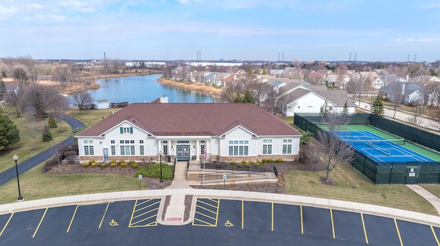 bird's eye view featuring a water view and a residential view