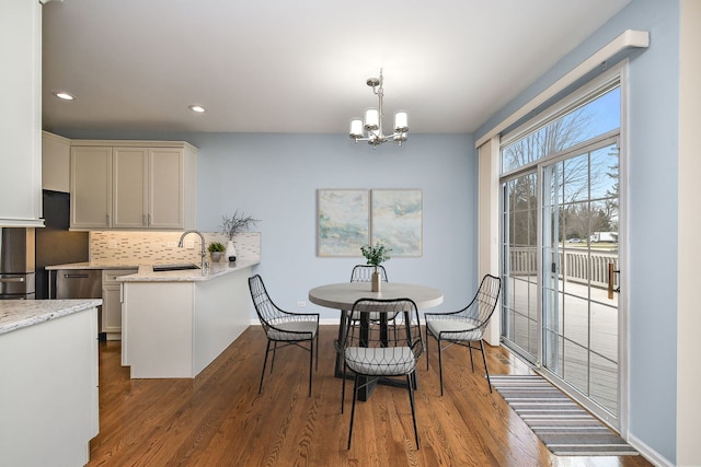 1834 Highbury Ln, Aurora, IL 60502 - dining area with wood finished floors, a chandelier, and recessed lighting