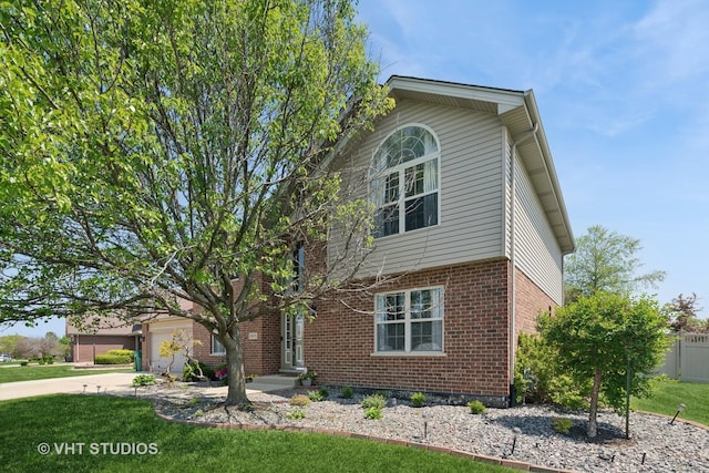 24515 Echo Ln, Manhattan, IL 60442 - view of front of home featuring driveway, brick siding, and a garage