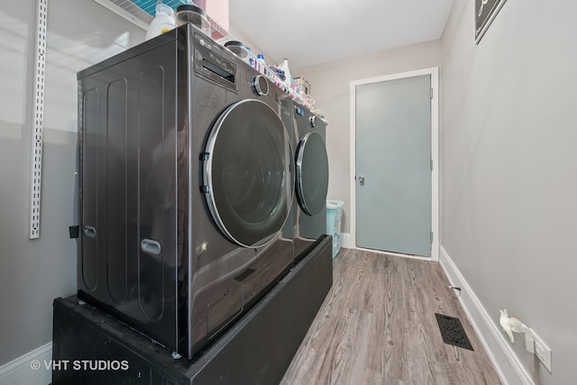 24515 Echo Ln, Manhattan, IL 60442 - laundry area with wood finished floors, baseboards, and washing machine and dryer