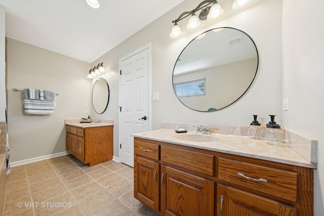 24515 Echo Ln, Manhattan, IL 60442 - bathroom featuring two vanities, baseboards, and tile patterned flooring
