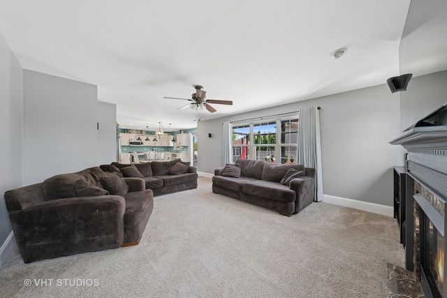 24515 Echo Ln, Manhattan, IL 60442 - carpeted living room with baseboards, a glass covered fireplace, and ceiling fan