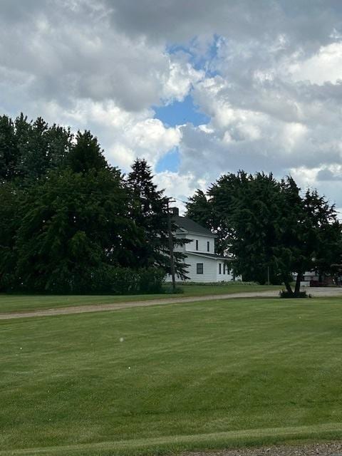 view of home's community featuring a yard