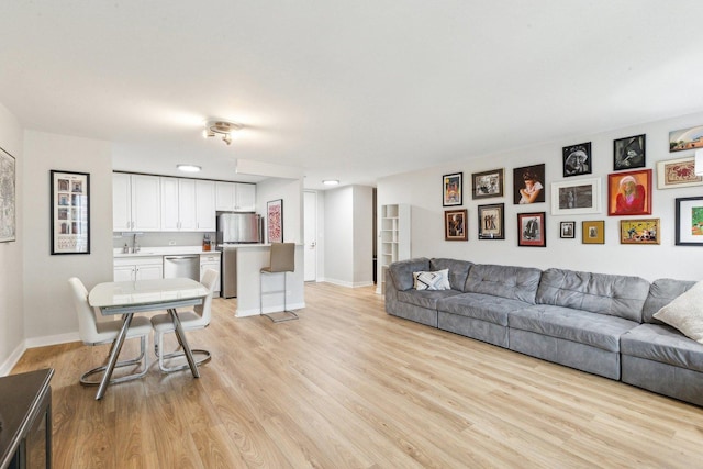 400 E Randolph St Unit 2424, Chicago, IL 60601 - living area featuring baseboards and light wood-style flooring