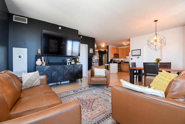 1101 S State St Unit 2100, Chicago, IL 60605 - living area with visible vents and light wood-style flooring