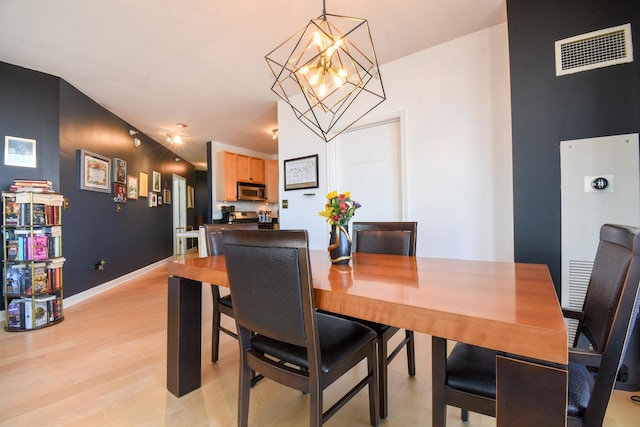 1101 S State St Unit 2100, Chicago, IL 60605 - dining room with a notable chandelier, visible vents, baseboards, and light wood finished floors