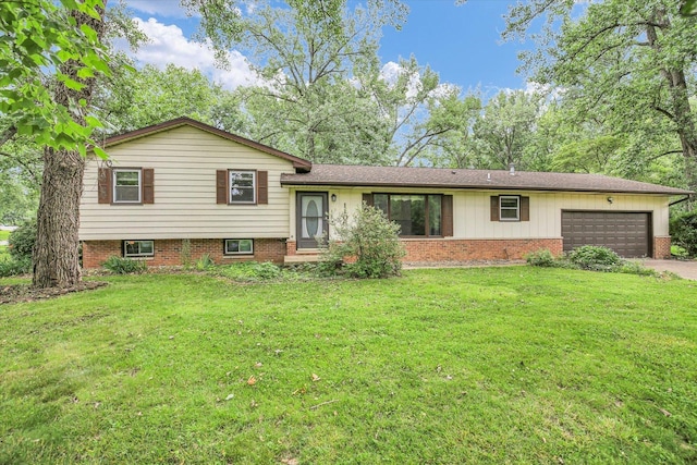 1106 Riverside Ct, Mahomet, IL 61853 - split level home featuring a garage, a front lawn, asphalt driveway, and brick siding