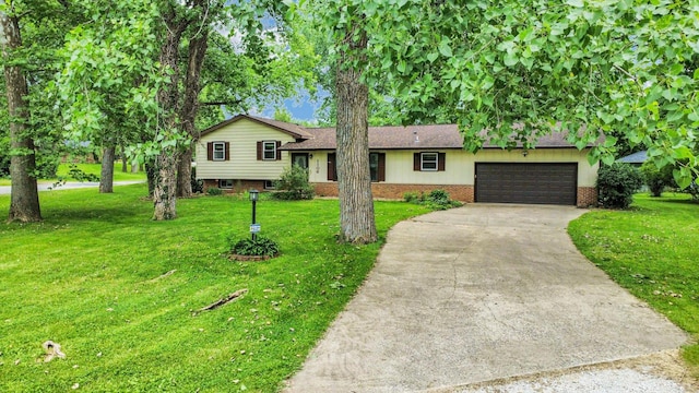 1106 Riverside Ct, Mahomet, IL 61853 - split level home with concrete driveway, an attached garage, a front lawn, and brick siding
