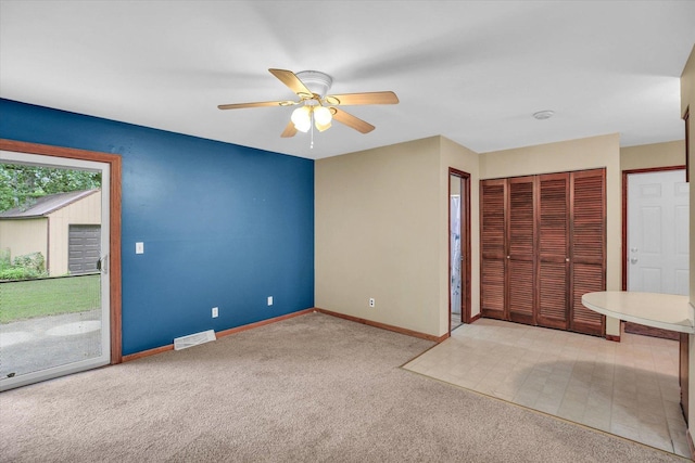 1106 Riverside Ct, Mahomet, IL 61853 - unfurnished bedroom with carpet floors, a closet, access to outside, and ceiling fan
