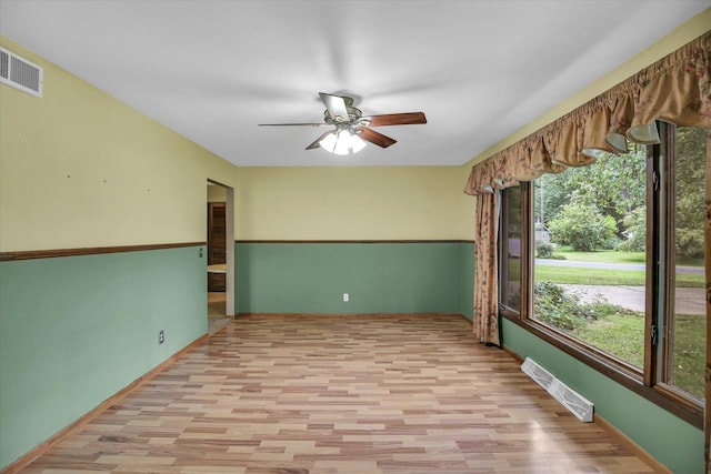 1106 Riverside Ct, Mahomet, IL 61853 - unfurnished room featuring light wood-style floors and a ceiling fan