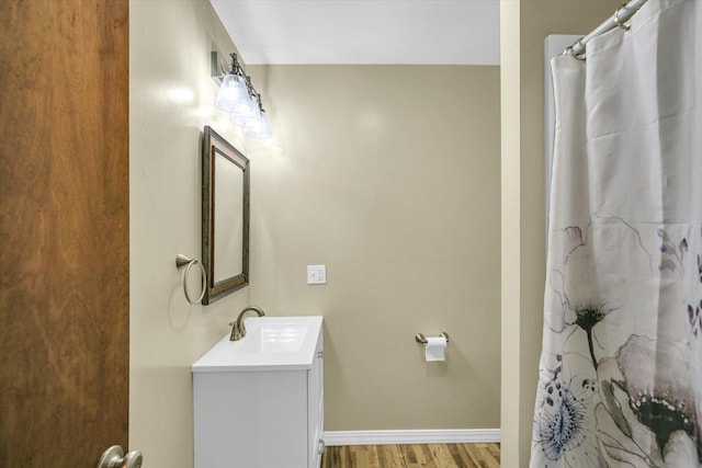 1106 Riverside Ct, Mahomet, IL 61853 - bathroom with vanity, wood finished floors, and curtained shower