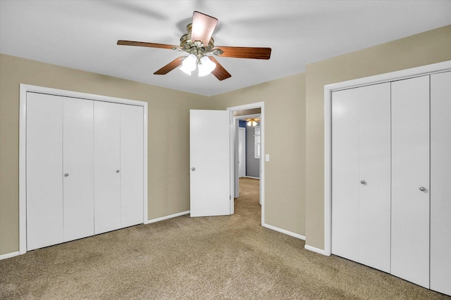 1106 Riverside Ct, Mahomet, IL 61853 - unfurnished bedroom with carpet flooring, a ceiling fan, and two closets