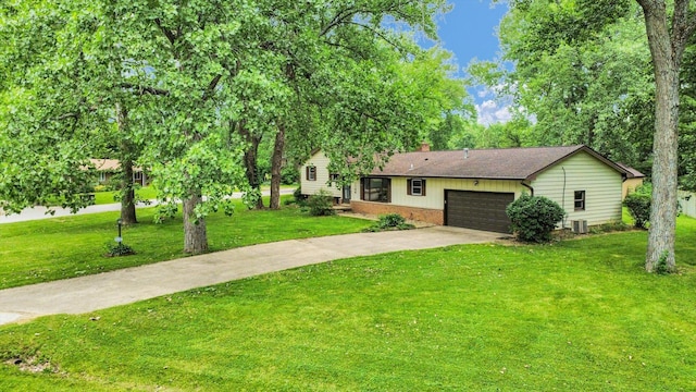 1106 Riverside Ct, Mahomet, IL 61853 - view of front facade featuring driveway, a chimney, a garage, a front lawn, and brick siding