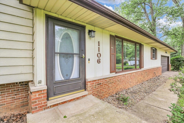 1106 Riverside Ct, Mahomet, IL 61853 - doorway to property with an attached garage and brick siding