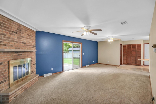 1106 Riverside Ct, Mahomet, IL 61853 - unfurnished living room featuring ceiling fan, carpet, and a brick fireplace