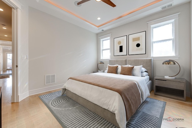 bedroom featuring light wood-style floors, recessed lighting, and visible vents