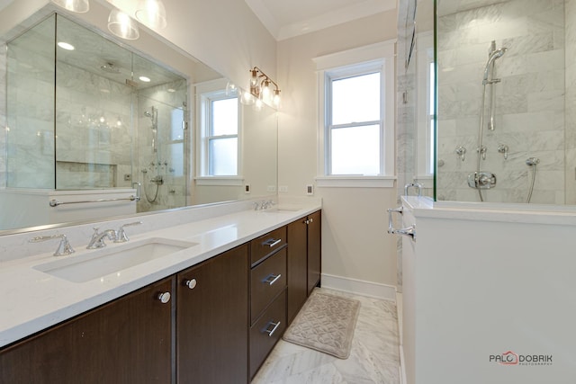 full bathroom featuring baseboards, a shower stall, a sink, and marble finish floor