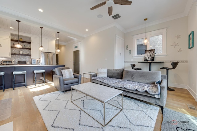 living area with visible vents, a ceiling fan, light wood-style flooring, and recessed lighting