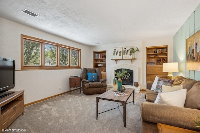 965 Sycamore Ct, Hoffman Estates, IL 60192 - carpeted living area with baseboards, built in shelves, a brick fireplace, a textured ceiling, and a textured wall