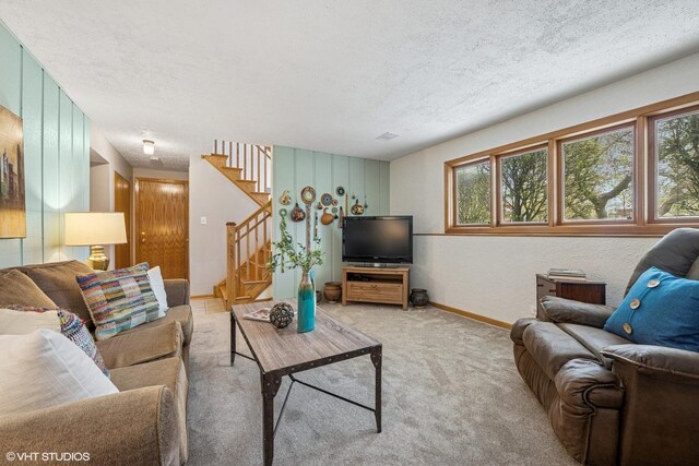 965 Sycamore Ct, Hoffman Estates, IL 60192 - living room featuring stairway, light carpet, a textured ceiling, and baseboards
