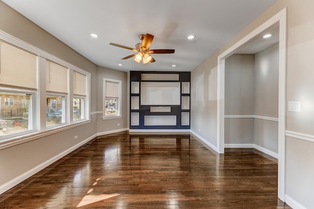 empty room with a ceiling fan, baseboards, recessed lighting, and wood finished floors