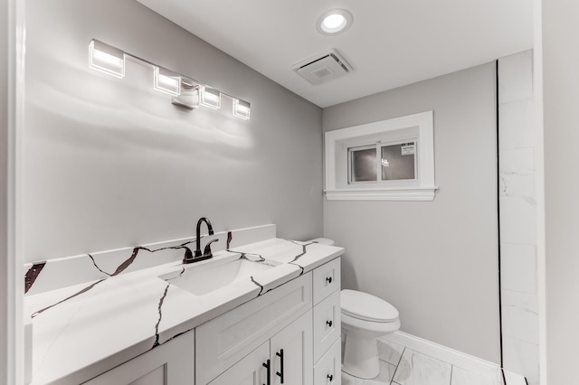 bathroom with visible vents, baseboards, vanity, toilet, and marble finish floor