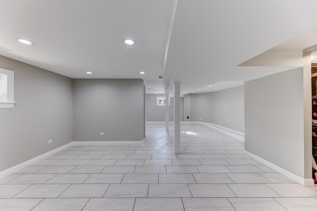 basement featuring recessed lighting and baseboards
