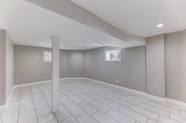 basement with recessed lighting and baseboards