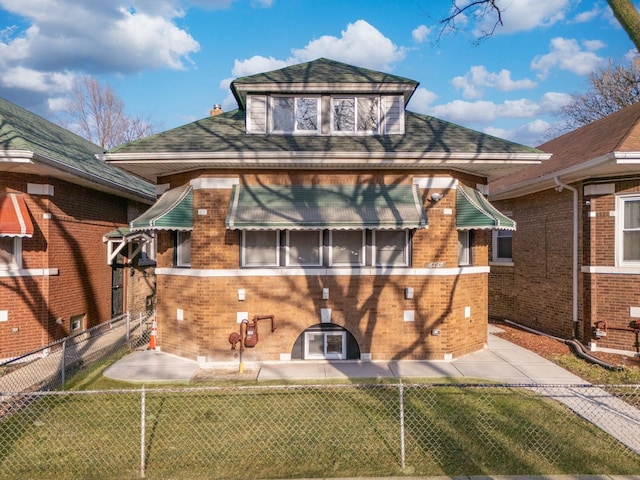 rear view of house featuring brick siding, a chimney, a yard, and fence private yard