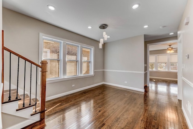 interior space featuring recessed lighting, stairway, baseboards, and hardwood / wood-style flooring