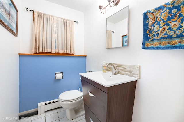 bathroom featuring vanity, tile patterned flooring, toilet, a baseboard heating unit, and backsplash