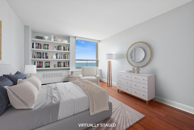 1460 N Sandburg Ter Unit 2608A, Chicago, IL 60610 - bedroom with baseboards, a water view, visible vents, and wood finished floors