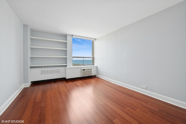 1460 N Sandburg Ter Unit 2608A, Chicago, IL 60610 - unfurnished room featuring baseboards and dark wood-style flooring