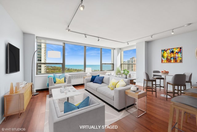 1460 N Sandburg Ter Unit 2608A, Chicago, IL 60610 - living area featuring a water view, rail lighting, and wood-type flooring