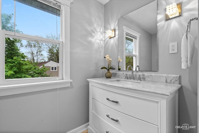 bathroom featuring vanity and baseboards