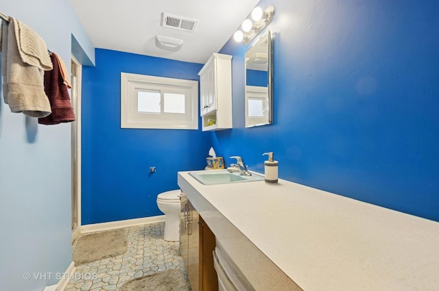 9336 Lavergne Ave, Skokie, IL 60077 - bathroom with toilet, baseboards, and vanity