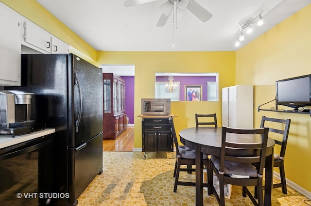 9336 Lavergne Ave, Skokie, IL 60077 - dining room featuring ceiling fan, baseboards, and light wood-style flooring