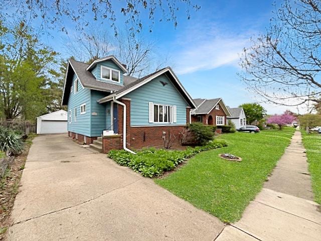 524 Saint Louis Ave, Rockford, IL 61104 - view of front of house featuring a garage, an outdoor structure, a front lawn, and brick siding