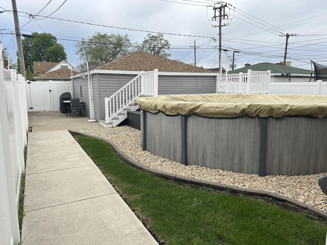 1828 N 21st Ave, Melrose Park, IL 60160 - view of yard featuring a fenced backyard, a fenced in pool, and an outdoor structure