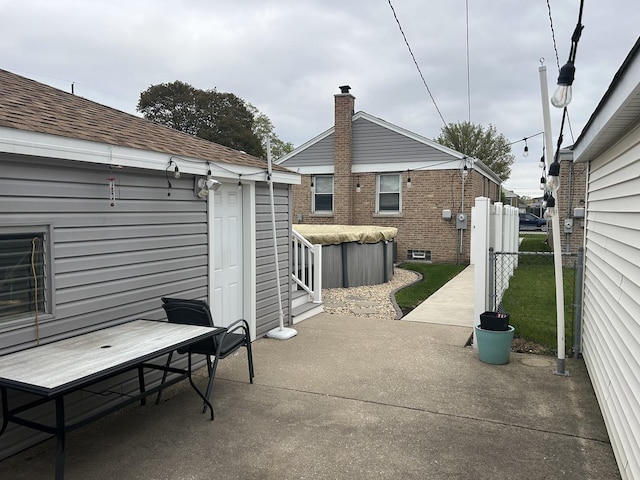 1828 N 21st Ave, Melrose Park, IL 60160 - view of patio with fence and a jacuzzi