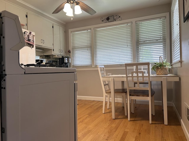 1828 N 21st Ave, Melrose Park, IL 60160 - kitchen with baseboards, ceiling fan, light wood-type flooring, and white cabinets
