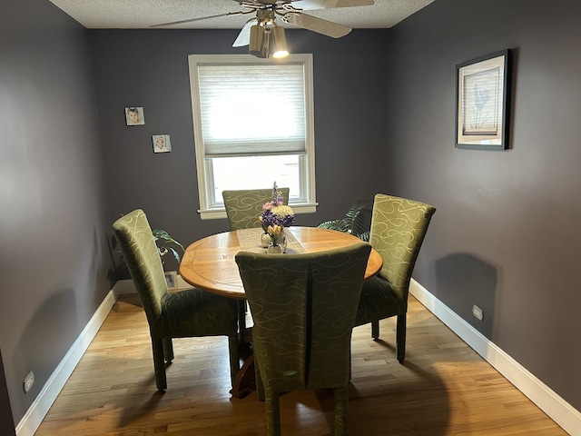 1828 N 21st Ave, Melrose Park, IL 60160 - dining space with baseboards, light wood-style floors, and ceiling fan