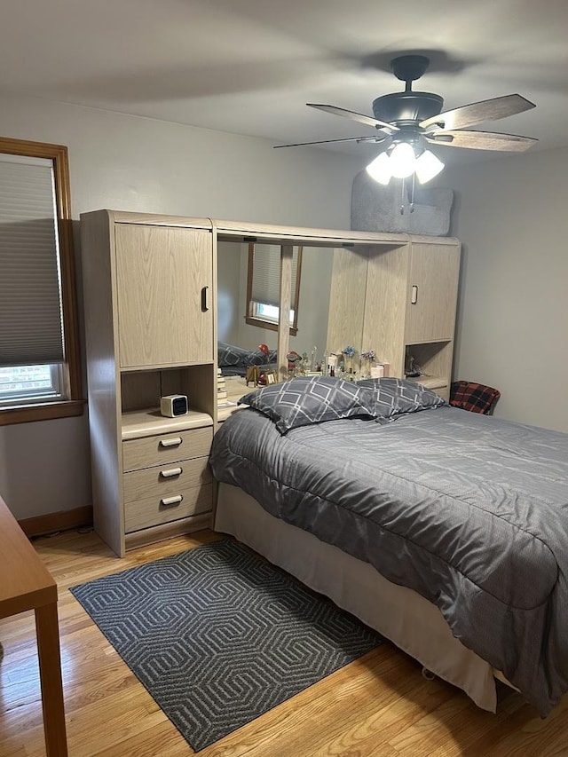 1828 N 21st Ave, Melrose Park, IL 60160 - bedroom with a ceiling fan and light wood-style flooring