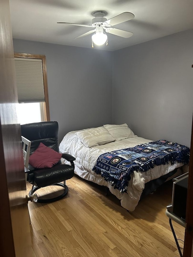 1828 N 21st Ave, Melrose Park, IL 60160 - bedroom with a ceiling fan and wood finished floors