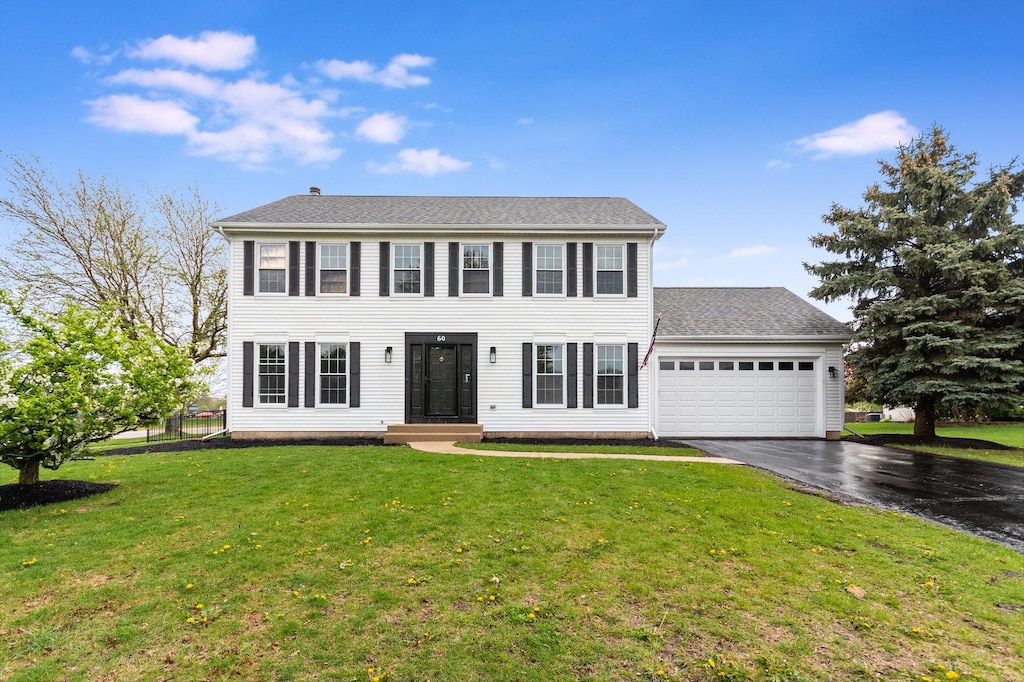 60 Barn Swallow Ct, Aurora, IL 60506 - colonial inspired home with an attached garage, driveway, and a front yard